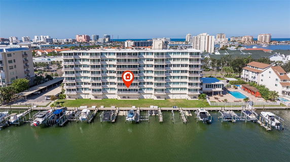 Front view of a multi-story waterfront apartment building.