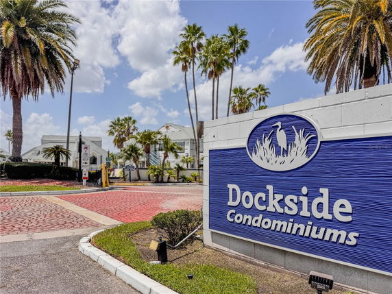 Entrance sign and buildings of a condominium complex.