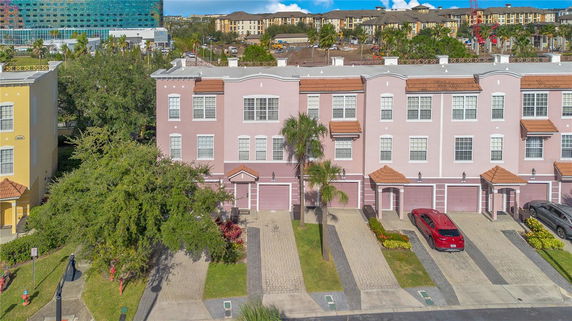 Front view of a multi-story residential building with attached garages.