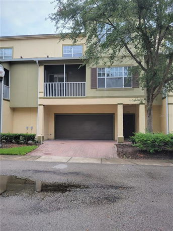 Front view of a multi-story house with a double garage.