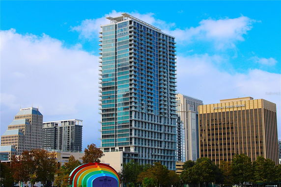 Front view of a tall modern high-rise building.