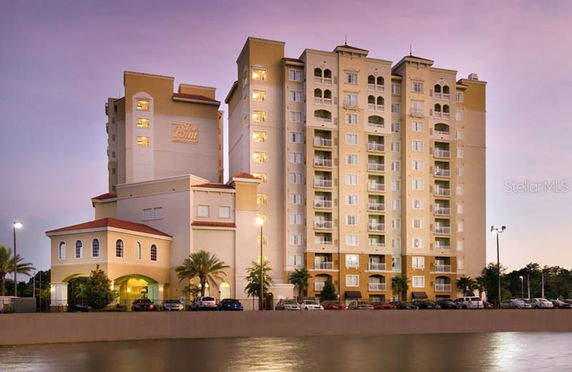 Front view of a multi-story residential building with balconies.