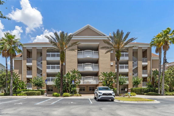 Front view of a multi-story building with balconies.