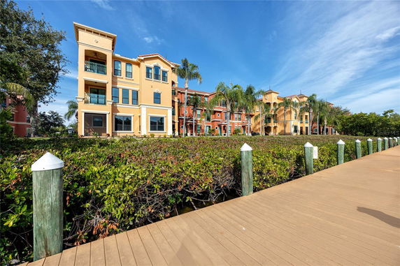 Front view of a multi-story residential building with balconies.