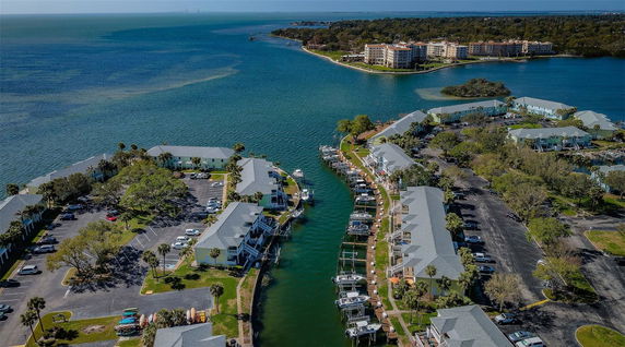 Aerial view of buildings with adjacent waterways and a distant coast.