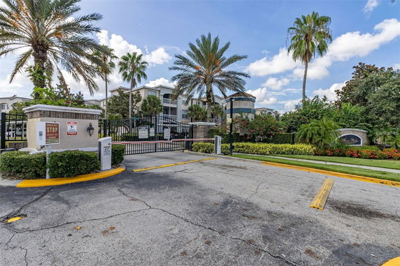 Front view of a residential complex with a gated entrance.