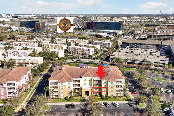 Panoramic view of residential buildings and surrounding area from above.