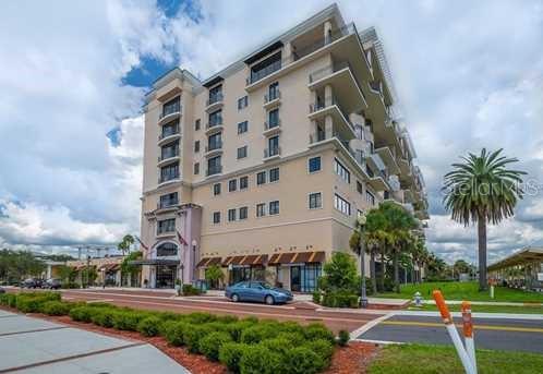 Front view of a multi-story apartment building with balconies.