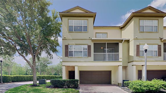 Front view of a multi-story house with a garage