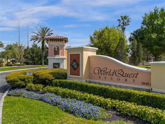 Front view of a resort entrance with decorative signage.