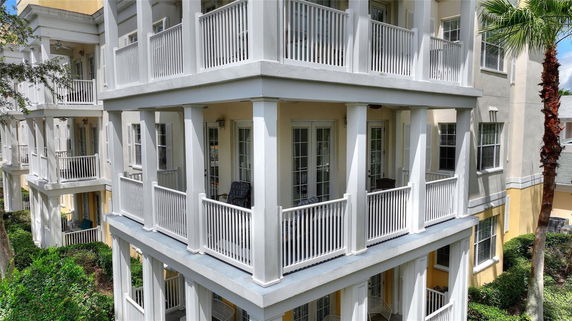 Front view of a multi-story building with balconies.