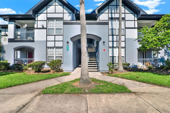Front view of a two-story residential building with a central staircase.