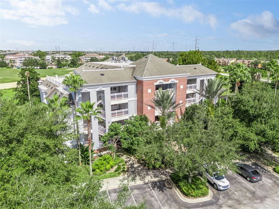 Front view of a multi-story residential building with balconies.