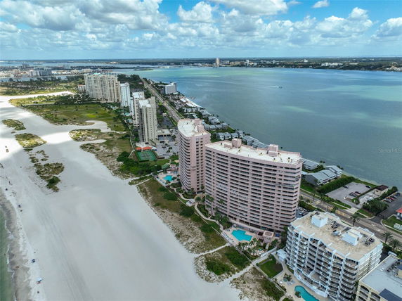 Aerial view of beachfront high-rise buildings and the coastline.
