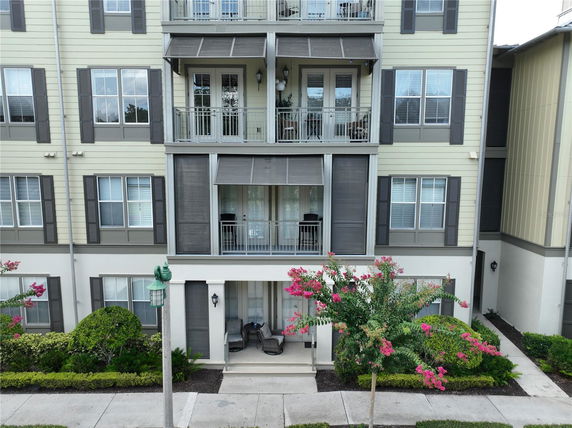 Front view of a multi-story residential building with balconies.