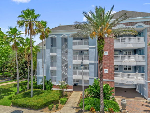 Front view of a multi-story residential building with balconies.