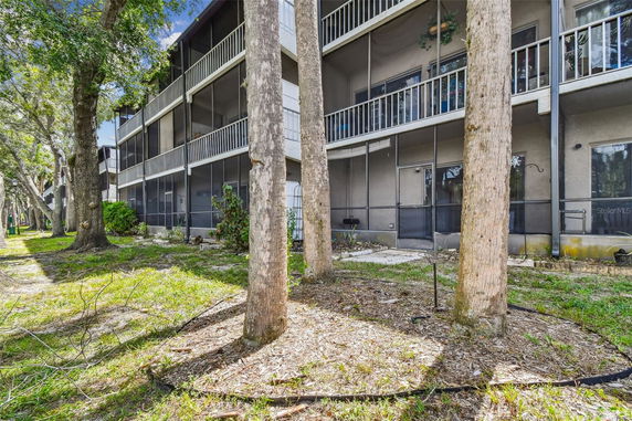 View of a multi-story building with screened balconies.