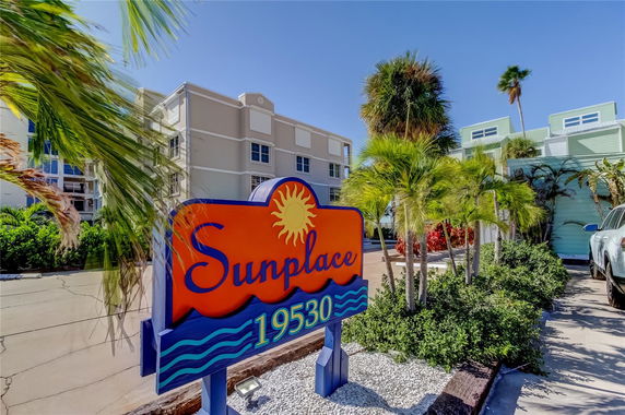 Front view of a multi-story building with signage reading Sunplace 19530.