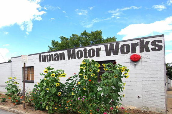 Front view of a building with Inman Motor Works sign.
