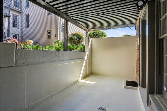 View of a partially enclosed outdoor area surrounded by buildings.