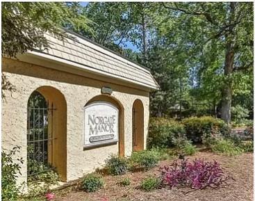 Front view of a building entrance with a sign reading 'Northgate Manor'.