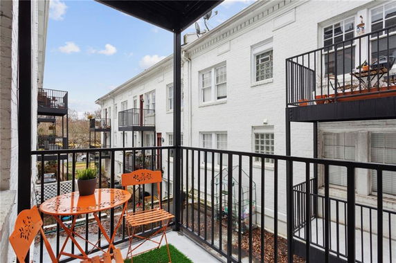 Balcony view of multi-story residential buildings with back-facing balconies.