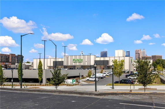 Front view of a commercial building with a parking area.