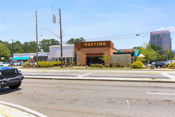 Front view of a commercial building named Postino with a modern facade.