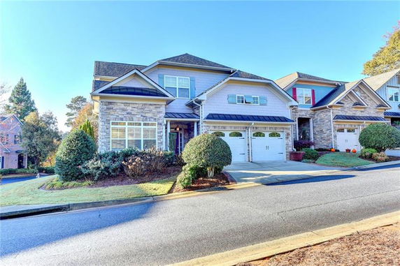 Front view of a two-story house with a double garage.
