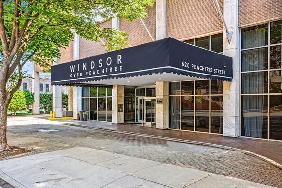 Exterior view of a building entrance with a canopy labeled 'Windsor Over Peachtree'.