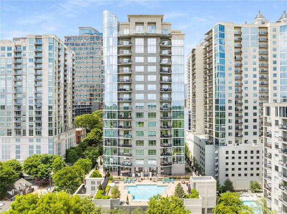 Front view of a tall modern apartment building.