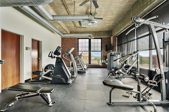 Interior view of a gym area with exercise equipment.