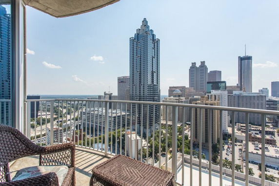 Panoramic view of city skyscrapers and buildings from a high vantage point.