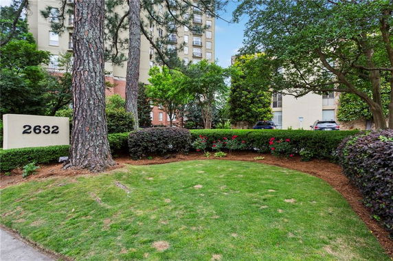 Surrounding view with trees and buildings in the background.