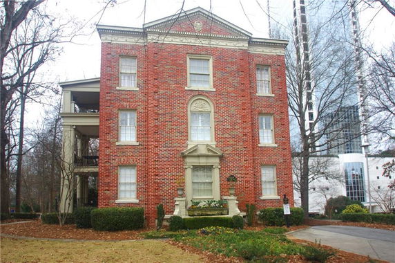 Front view of a three-story brick building.