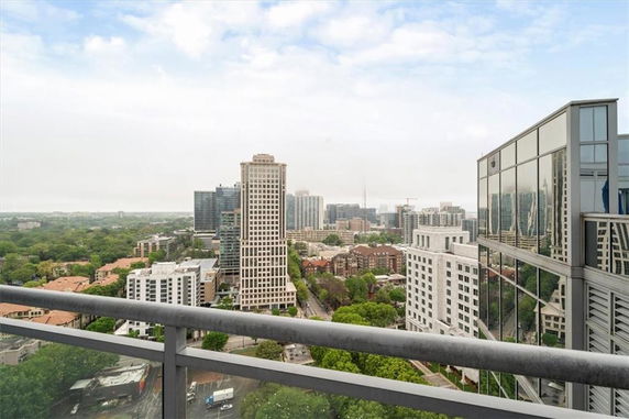 Panoramic view of a cityscape with multiple tall buildings.