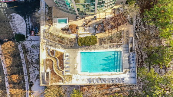 Aerial view of a swimming pool area adjacent to a building