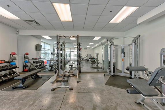 Interior view of a gym area with various exercise equipment.