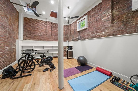 Indoor workout area with exercise equipment and yoga mats.