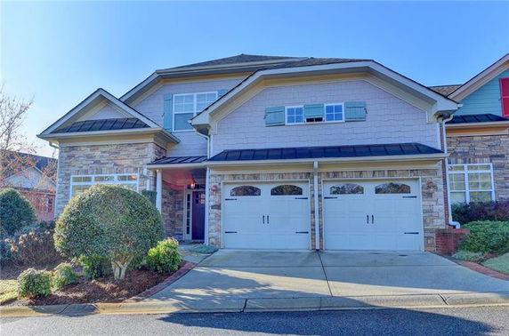 Front view of a two-story house with a double garage.
