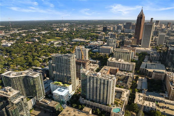 Wide angle view of a cityscape with tall buildings and urban surroundings.