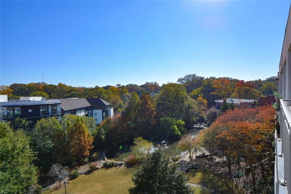 Panoramic view of buildings and trees seen from a high vantage point.