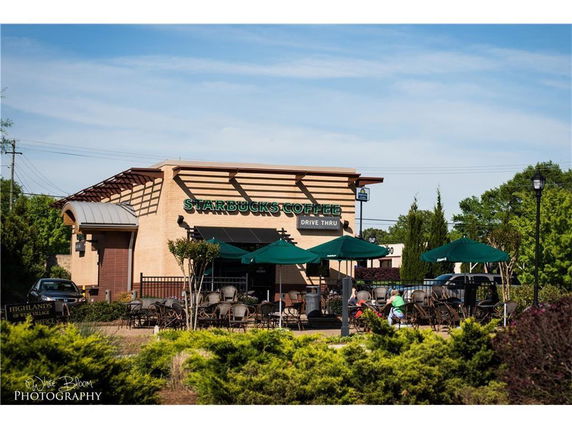 Front view of a coffee shop with a drive-thru.