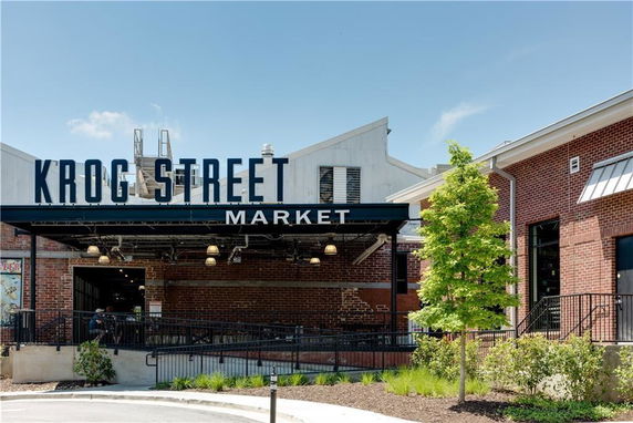 Front view of a market building with a large sign reading 'Krog Street Market'.