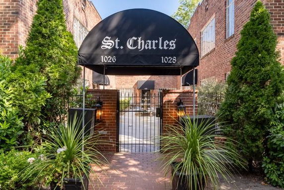 Front view of a brick building with an entrance canopy labeled 'St. Charles'.