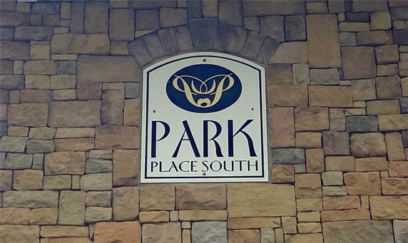 Stone wall with a sign that reads 'Park Place South'.