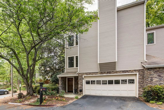 Front view of a multi-story house with a double garage