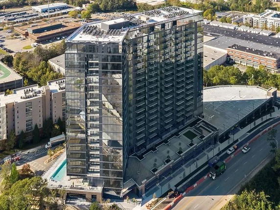 Aerial view of a high-rise building with a modern glass exterior.