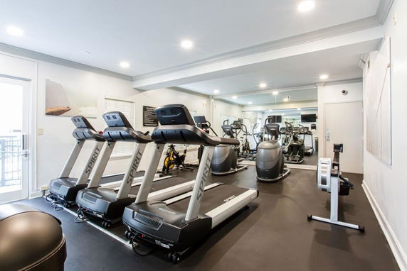 Indoor gym area with treadmills and exercise equipment.