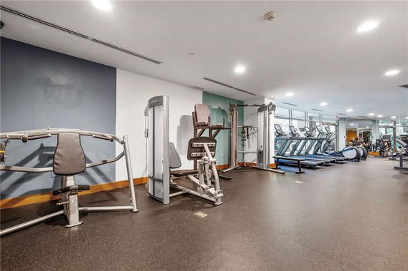 Indoor gym area with exercise machines and equipment